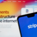 Stripe Payment provider logo seen on the smartphone and Stripe website on the blurred background. Not a montage, real photo. Stafford, United Kingdom, March 15, 2021.