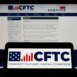 Person holding cellphone with logo of American Commodity Futures Trading Commission (CFTC) on screen in front of webpage. Focus on phone display.