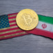 bitcoin token on flags of the United States and Islamic republic of Iran, brushed metal background.